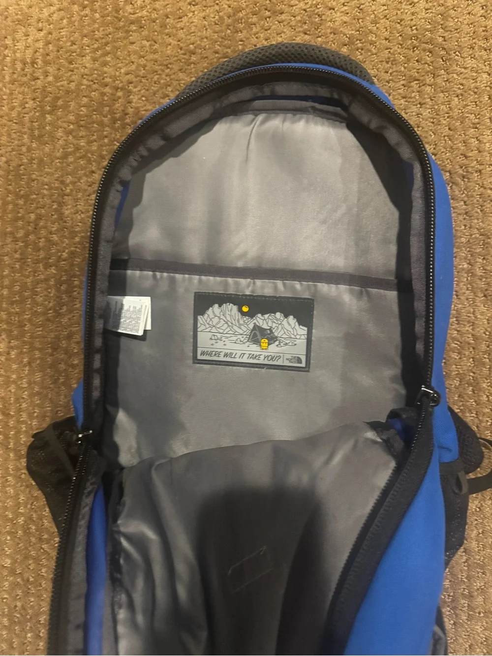 The North Face Blue and Black Backpack with Front Logo Connector